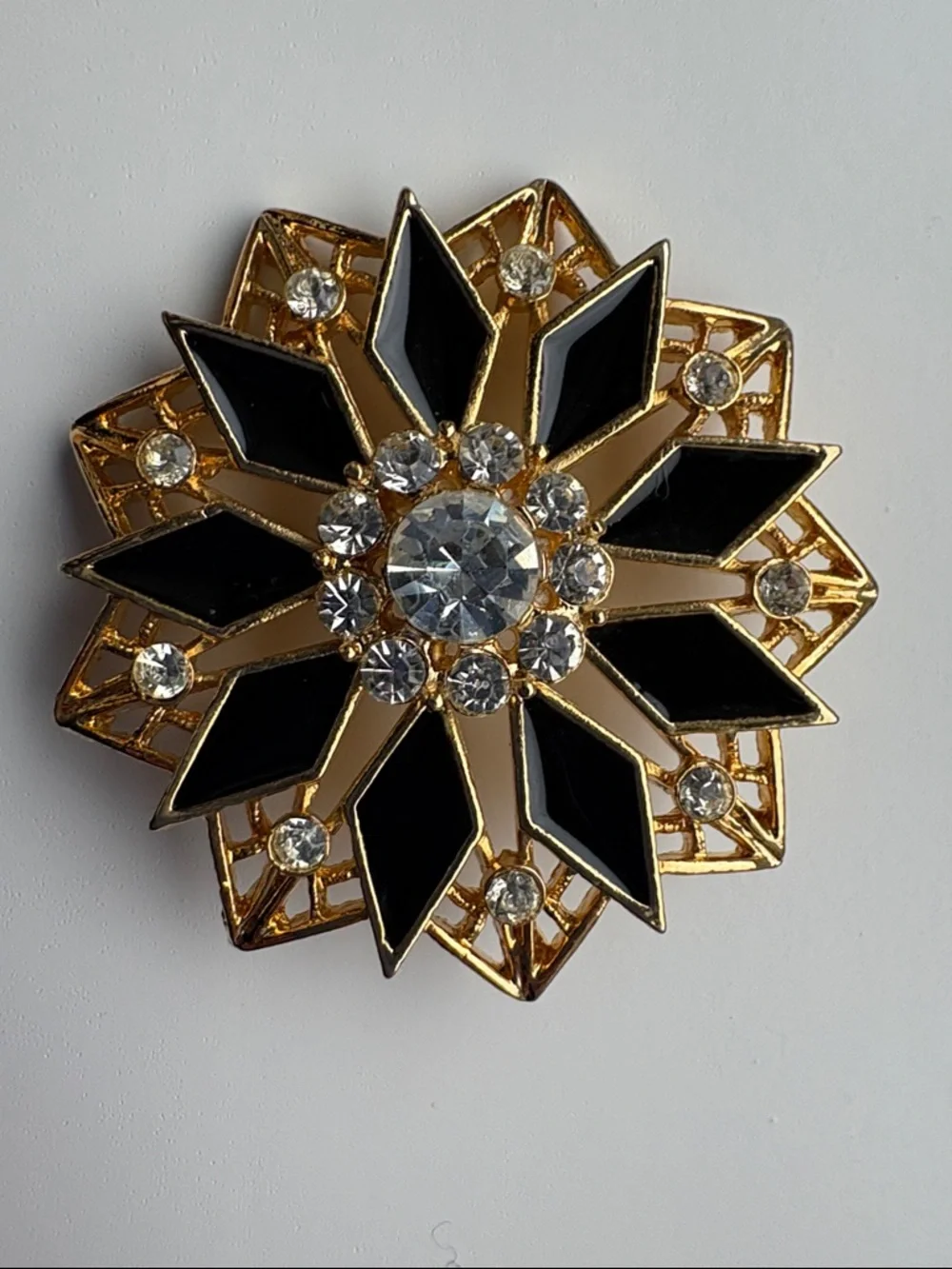 Vintage Gold Tone Black Enamel Starburst Brooch with Clear Rhinestones